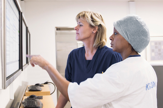 Nurses looking at the service plan