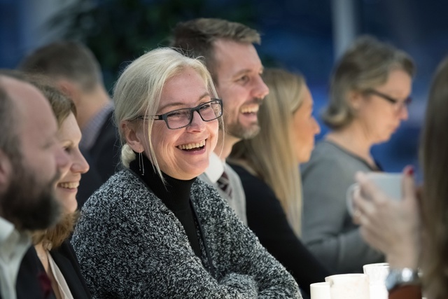 People laughing during meeting