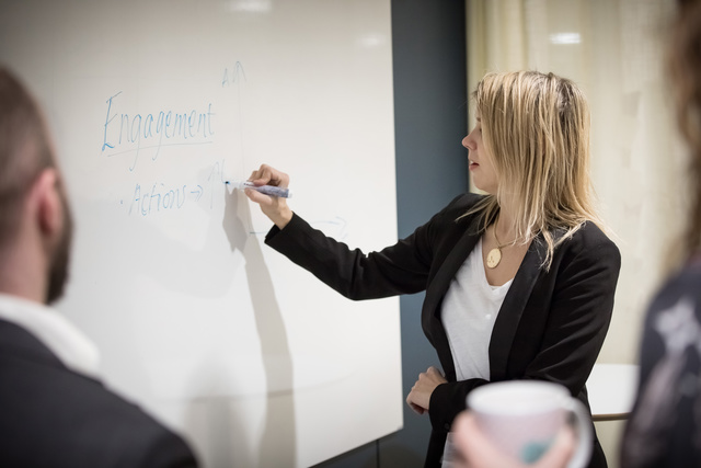 Woman drawing on a whiteboard